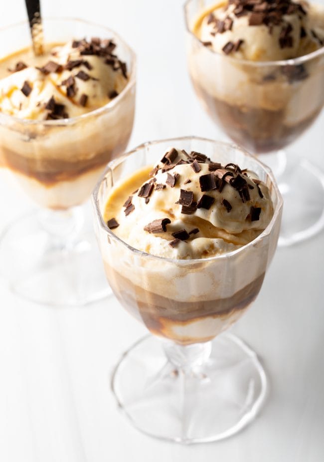 3 dessert glasses of Affogato al cafe topped with chocolate shavings.