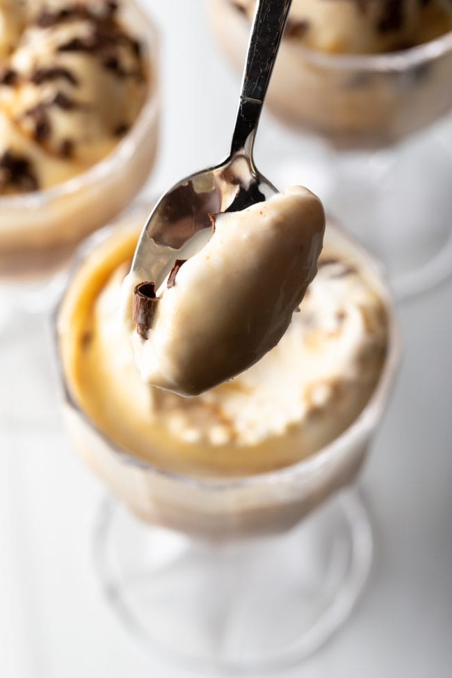 Spoon showing a scoop of ice cream with Kahlua and espresso to camera.