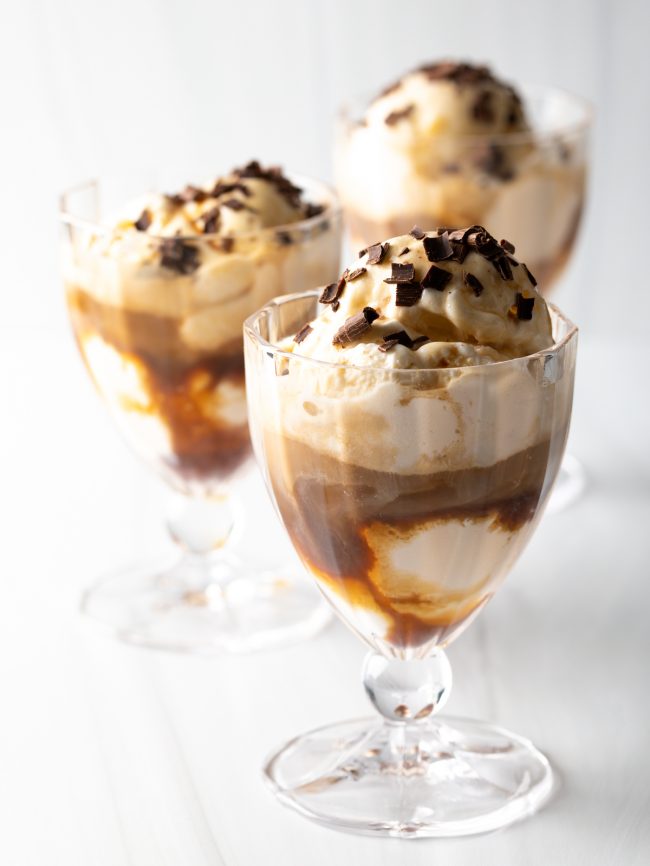 3 dessert glasses of Affogato al cafe topped with chocolate shavings.