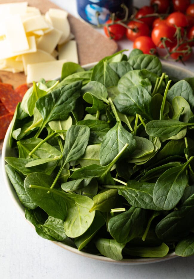 Bowl brimming with spinach.