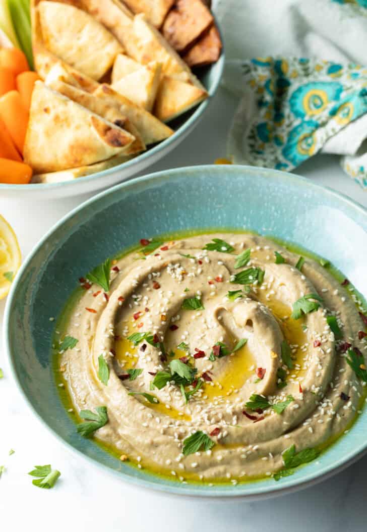 Light blue bowl of baba ganoush.