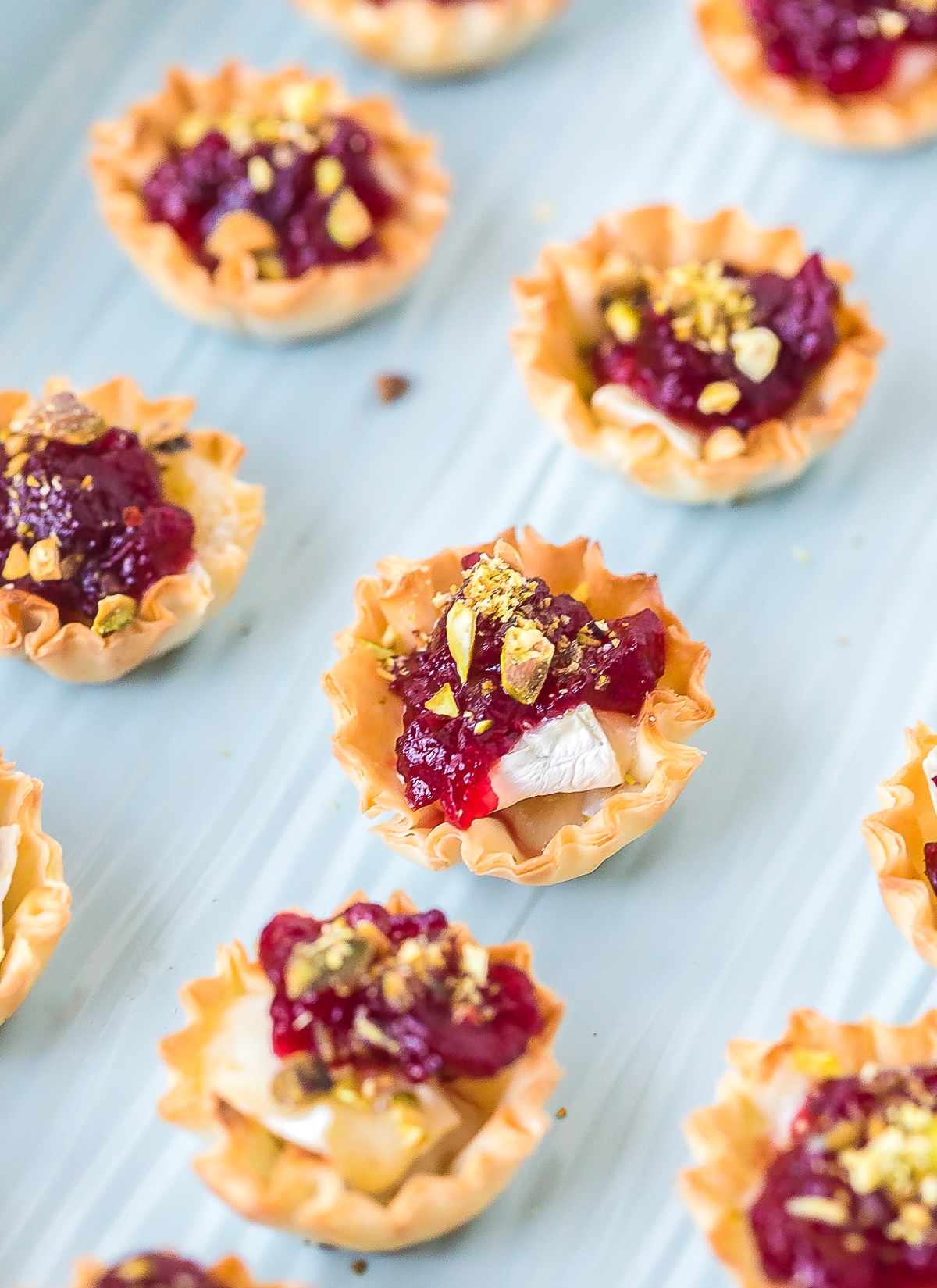 Mini Baked Brie Bites with Cranberry Sauce Recipe #ASpicyPerspective #brie #baked #cranberry