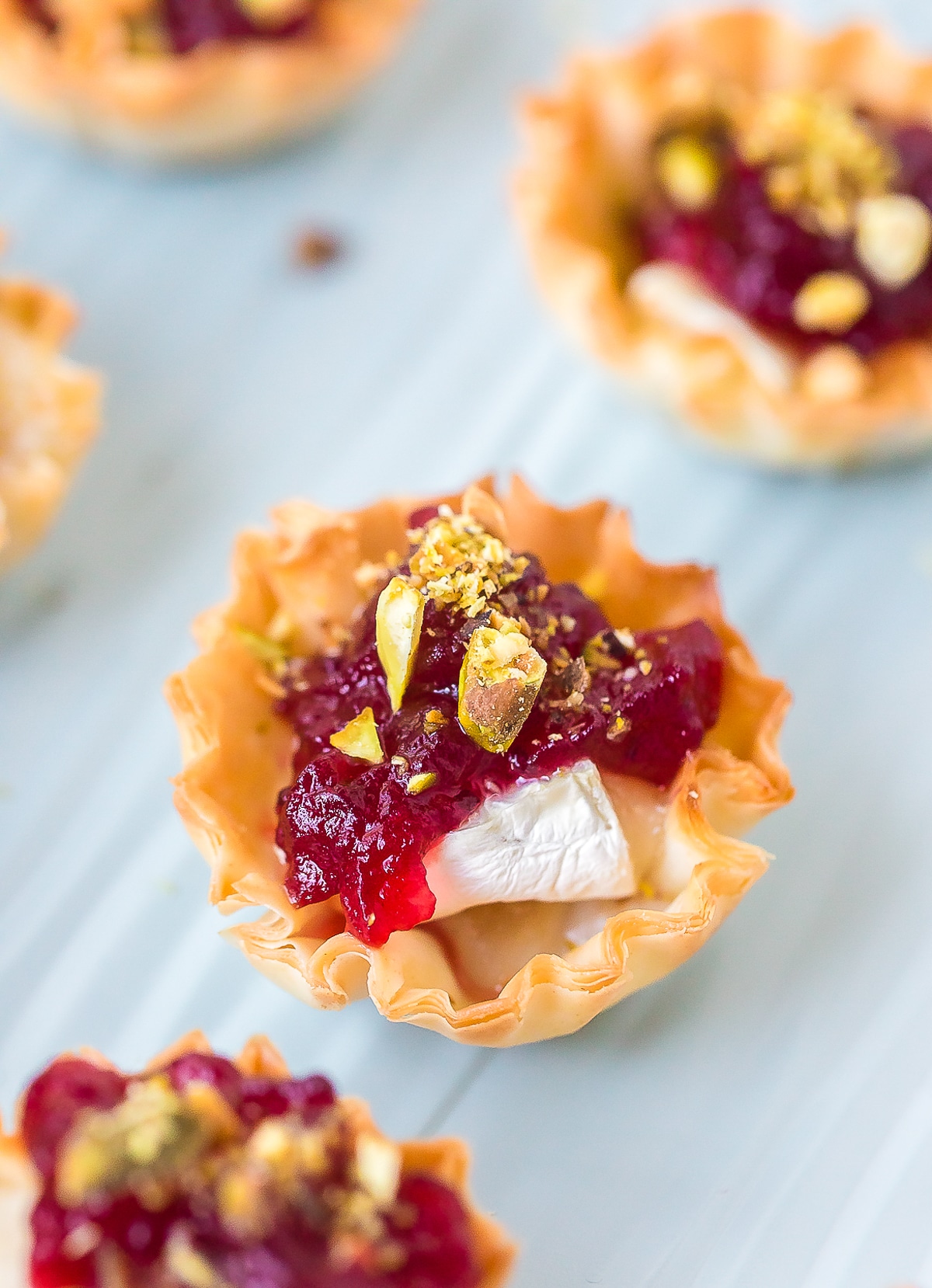 Easy Baked Brie Bites with Cranberry Sauce Recipe #ASpicyPerspective #brie #baked #cranberry 