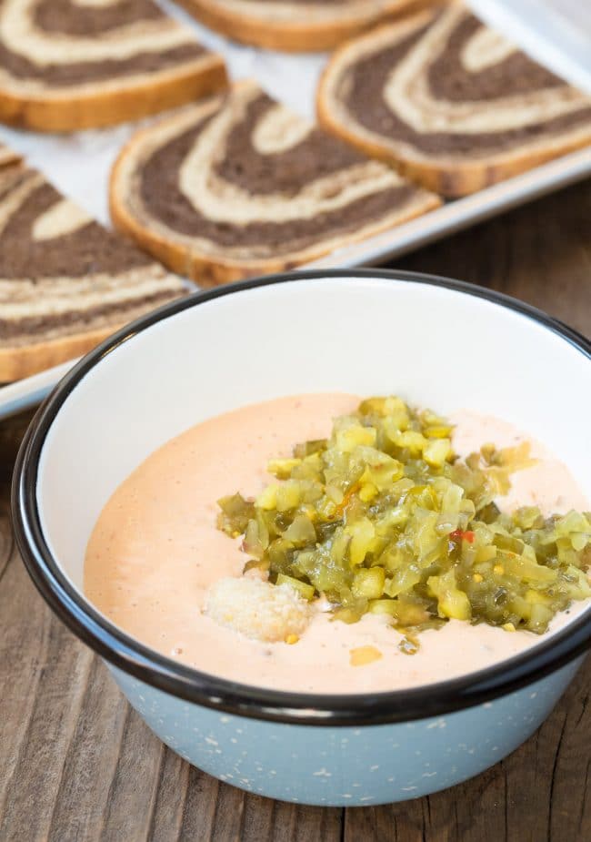 Thousand island dressing in a bowl mixed with horseradish and relish. 