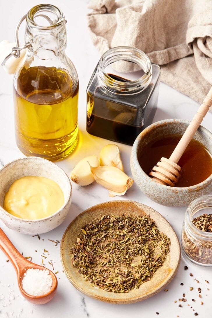 Ingredients needed for balsamic dressing recipe on counter.