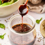 homemade salad dressing with balsamic vinegar poured over jar