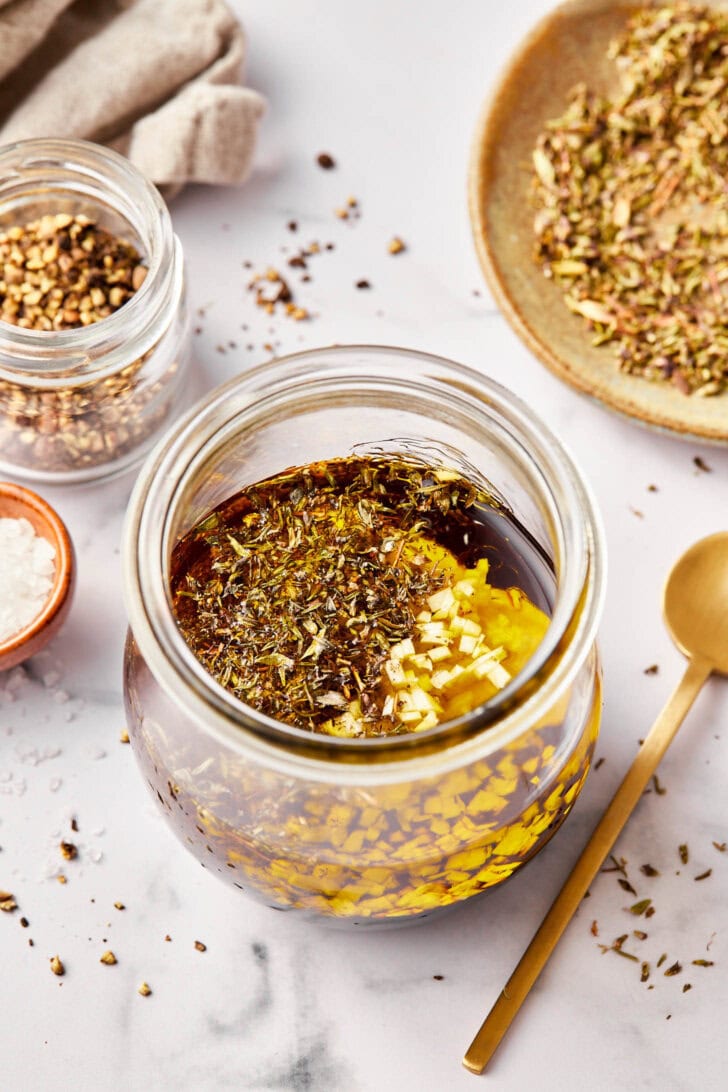 All ingredients for balsamic vinaigrette recipe in a jar. 