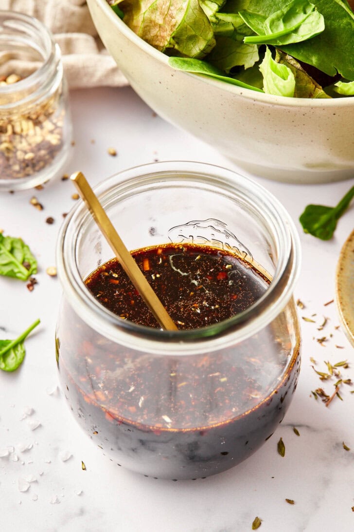 Balsamic Vinaigrette Recipe - Homemade balsamic salad dressing in jar with spoon.