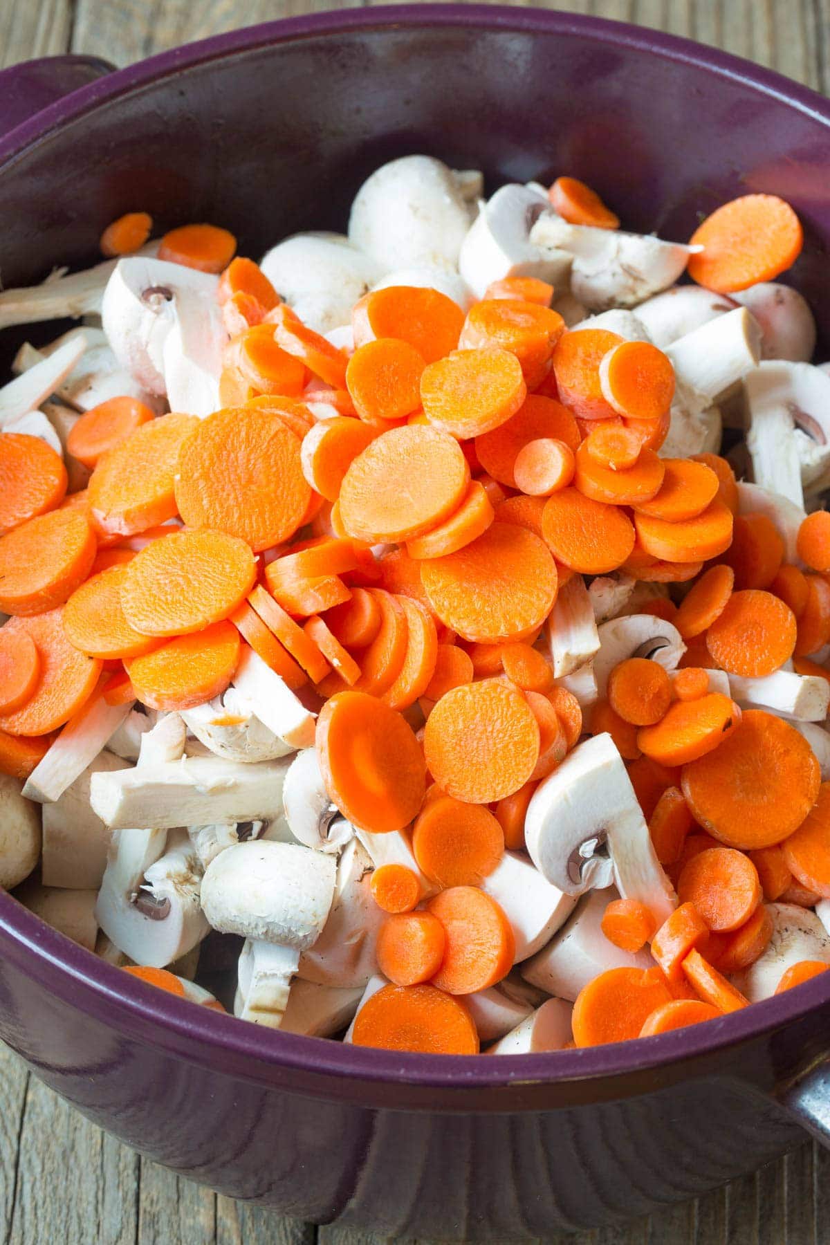 Carrots and mushrooms being added to the beef stew. 