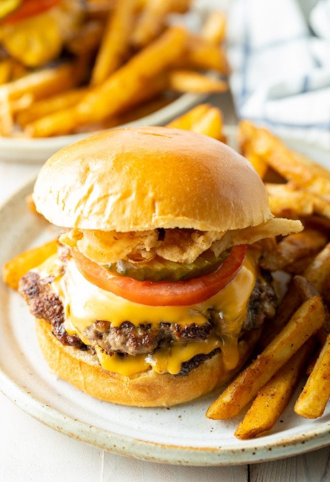 Best cheeseburger recipe with two patties and served with french fries. 