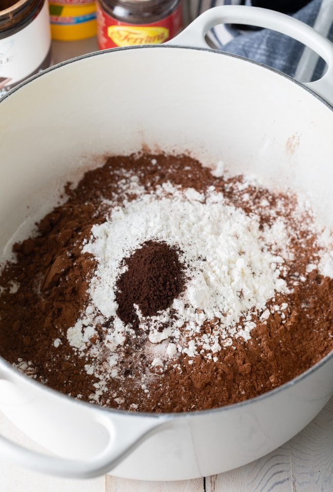 Dry ingredients needed for chocolate pudding in a large pot. 