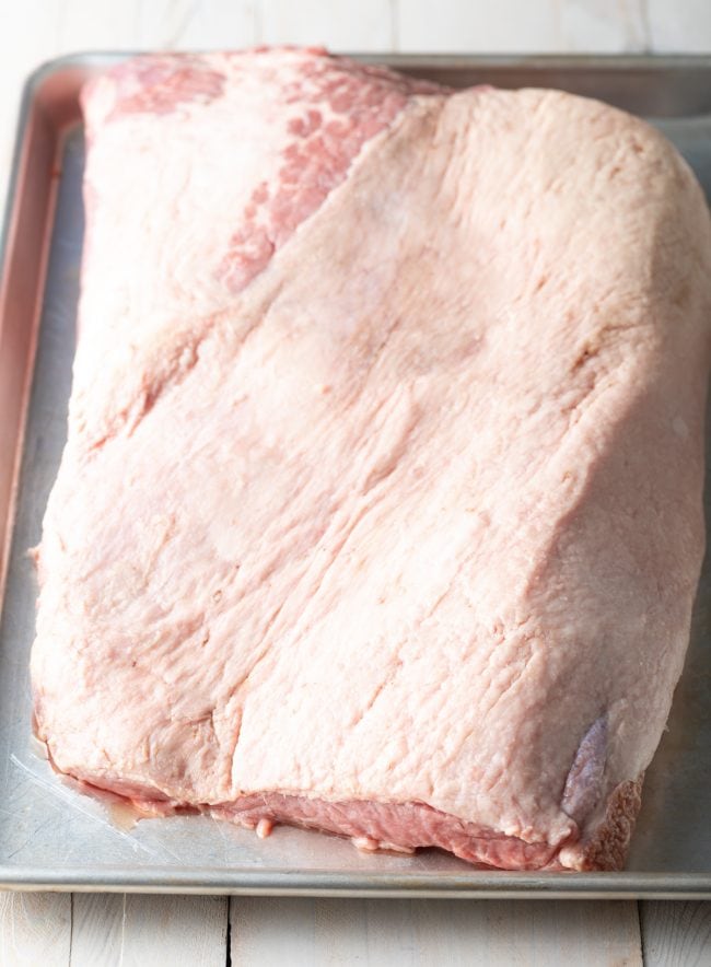 trimmed beef on a baking sheet before being cooked. 