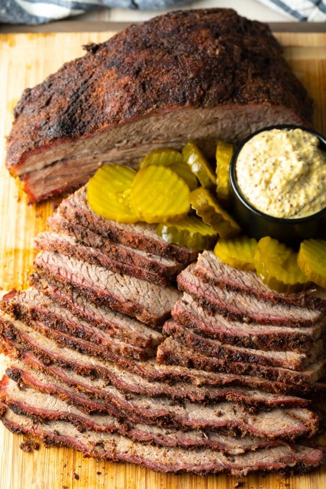 brisket smoked to perfection and sliced, served with pickles and mustard