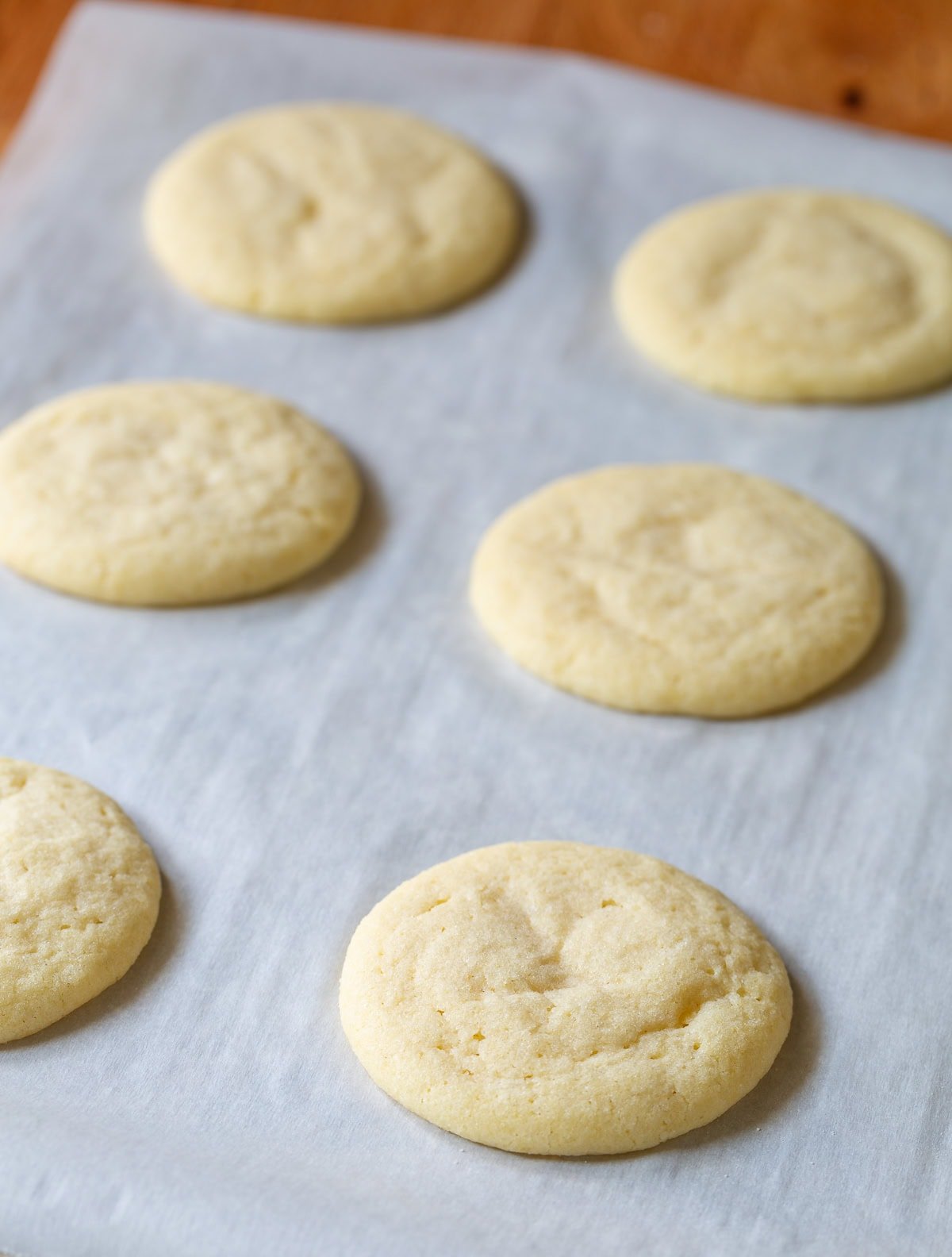 Side view of the best sugar cookies recipe on parchment paper