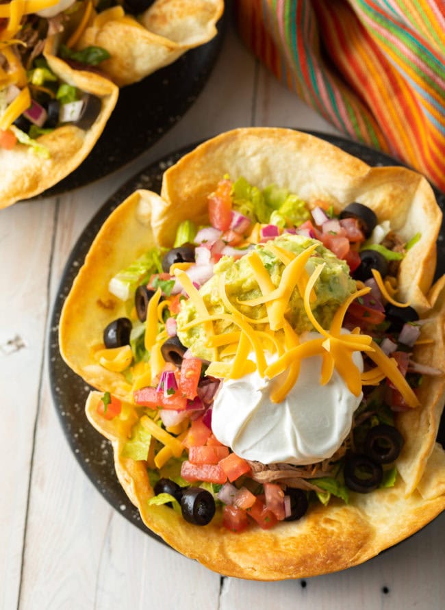 Overhead shot of taco salad in a homemade tortilla bowl. 