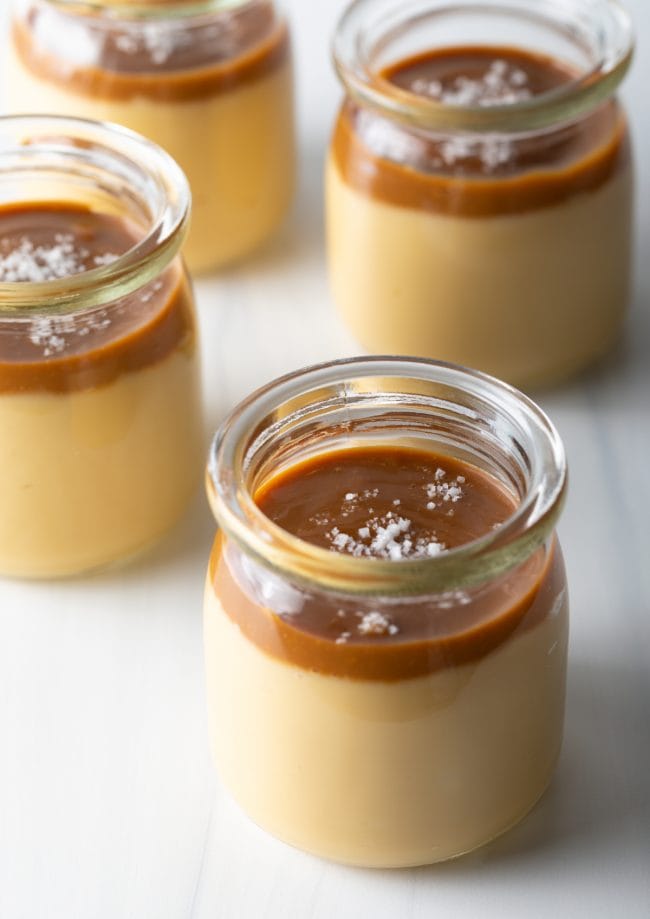 Italian Dessert Recipes - jars filled with homemade butterscotch pudding topped with caramel and sea salt