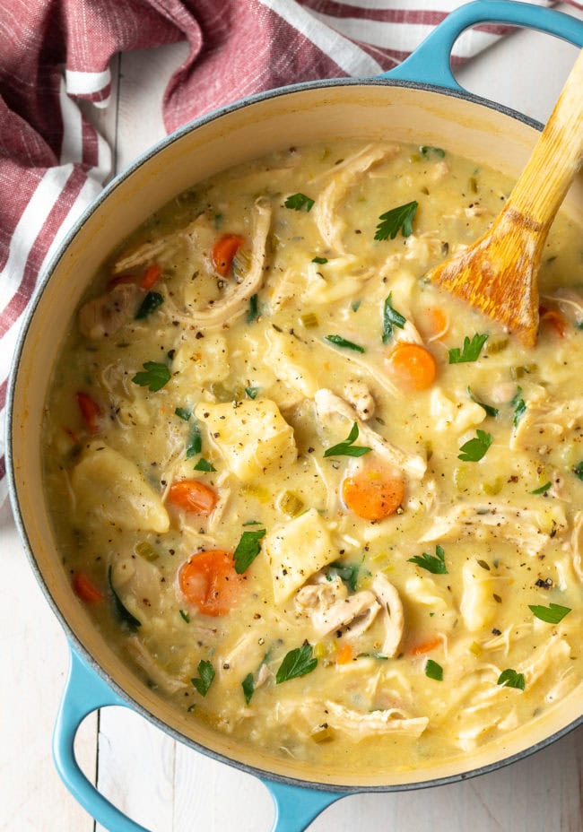 Stewing homemade noodles and chicken in a pot 
