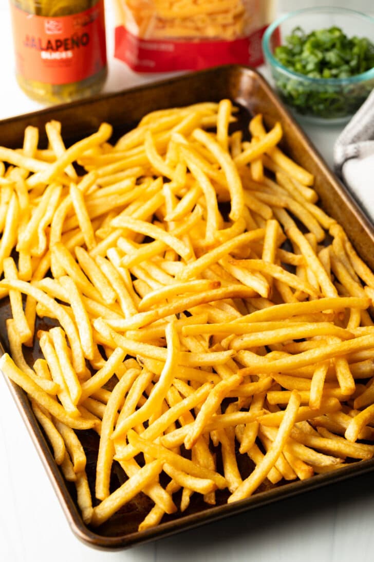 Baking sheet loaded with crispy fries.