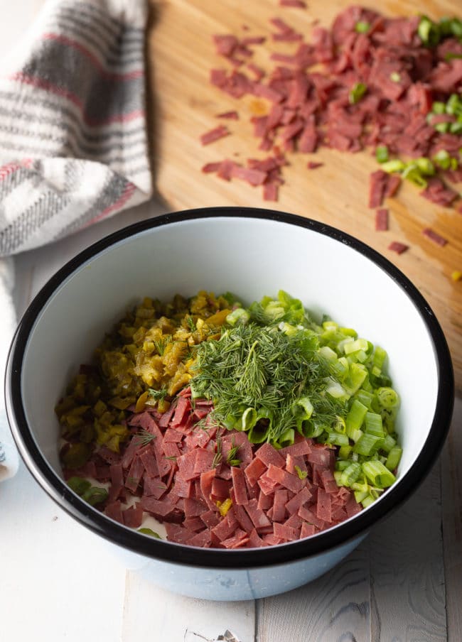 Chipped beef dip ingredients in a bowl before mixing. 