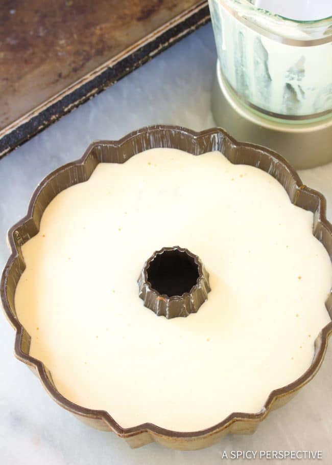 Flan mixture poured on top of the chocolate cake batter in the same bundt cake pan. 