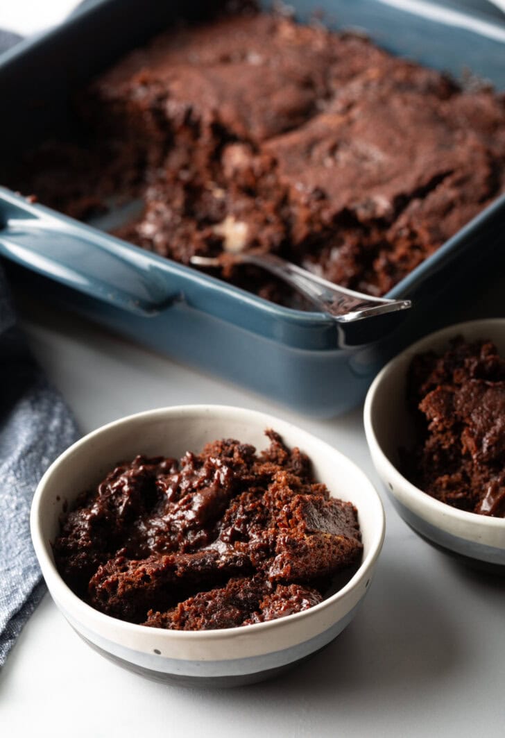 Serving of chocolate pudding cake in a white bowl.