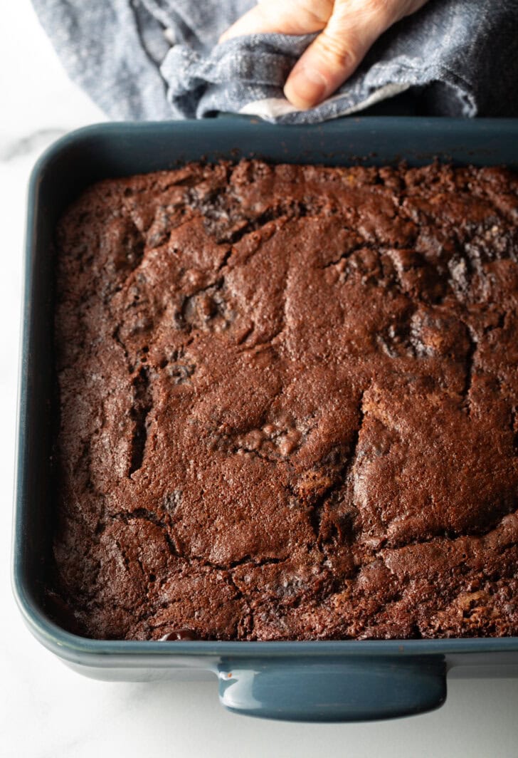 Baking pan with baked chocolate lava pudding cake.