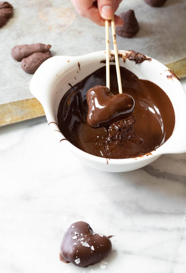 Dip the frozen whipped chocolate in melted chocolate 