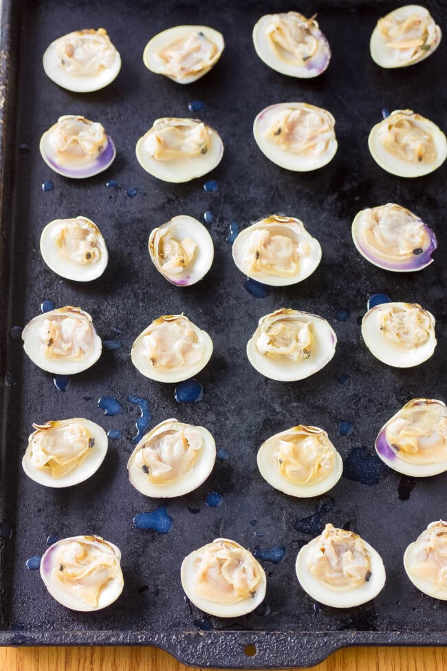 Making Clams Casino Recipe - open clams on baking sheet