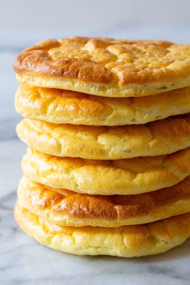 Stack of cloud bread on a marble surface.