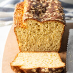 Loaf of bread, one piece sliced to show inside of the loaf.