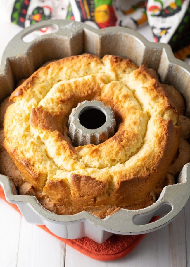 Finished easy bundt cake recipe looking light and airy and golden brown 
