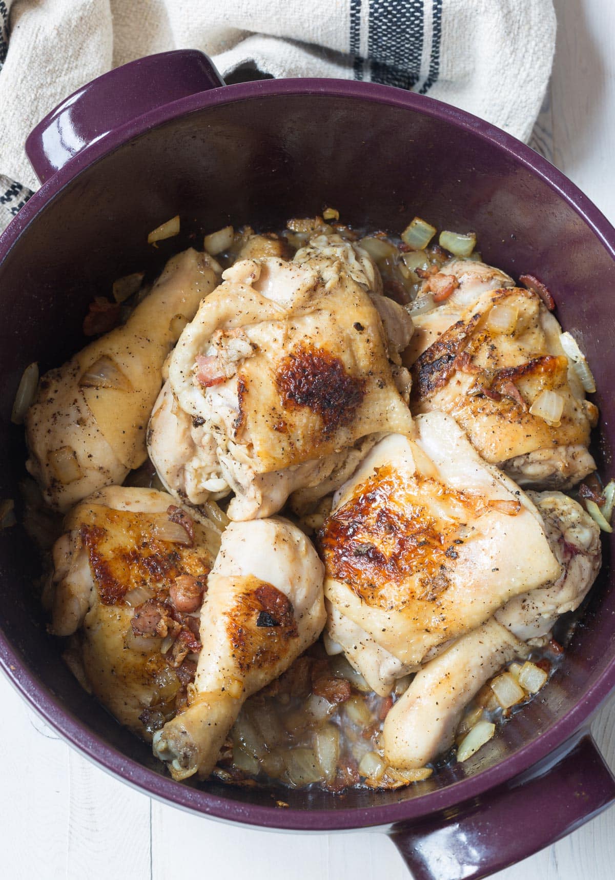 browned chicken pieces in pot