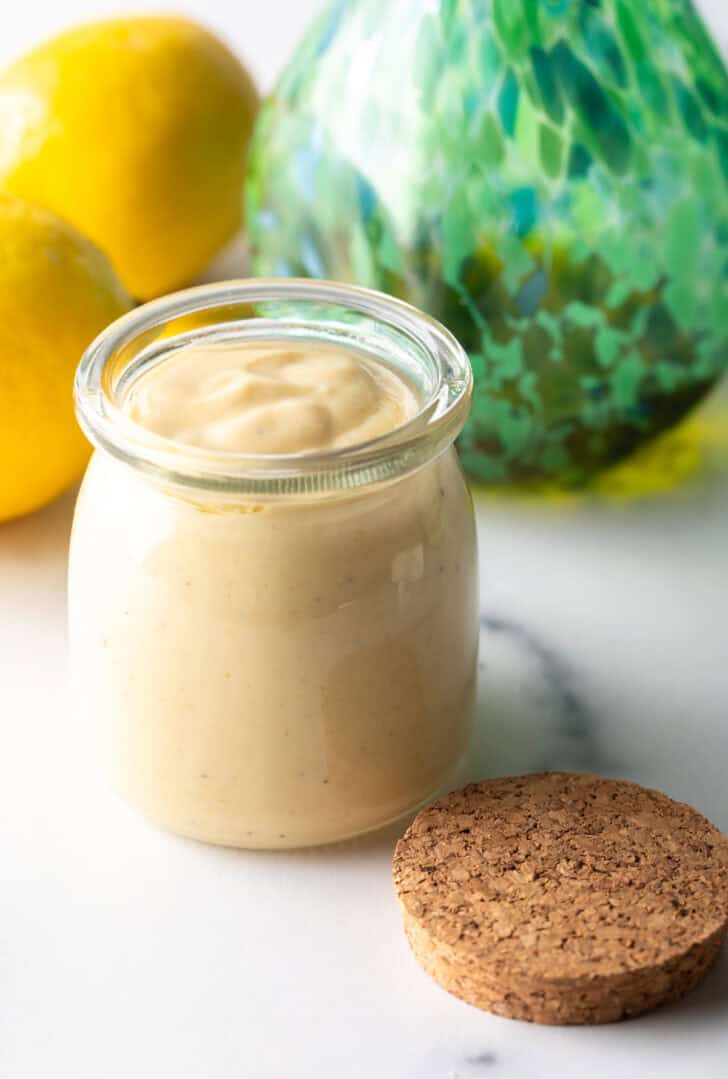 Glass jar filled with rich creamy tahini dressing.