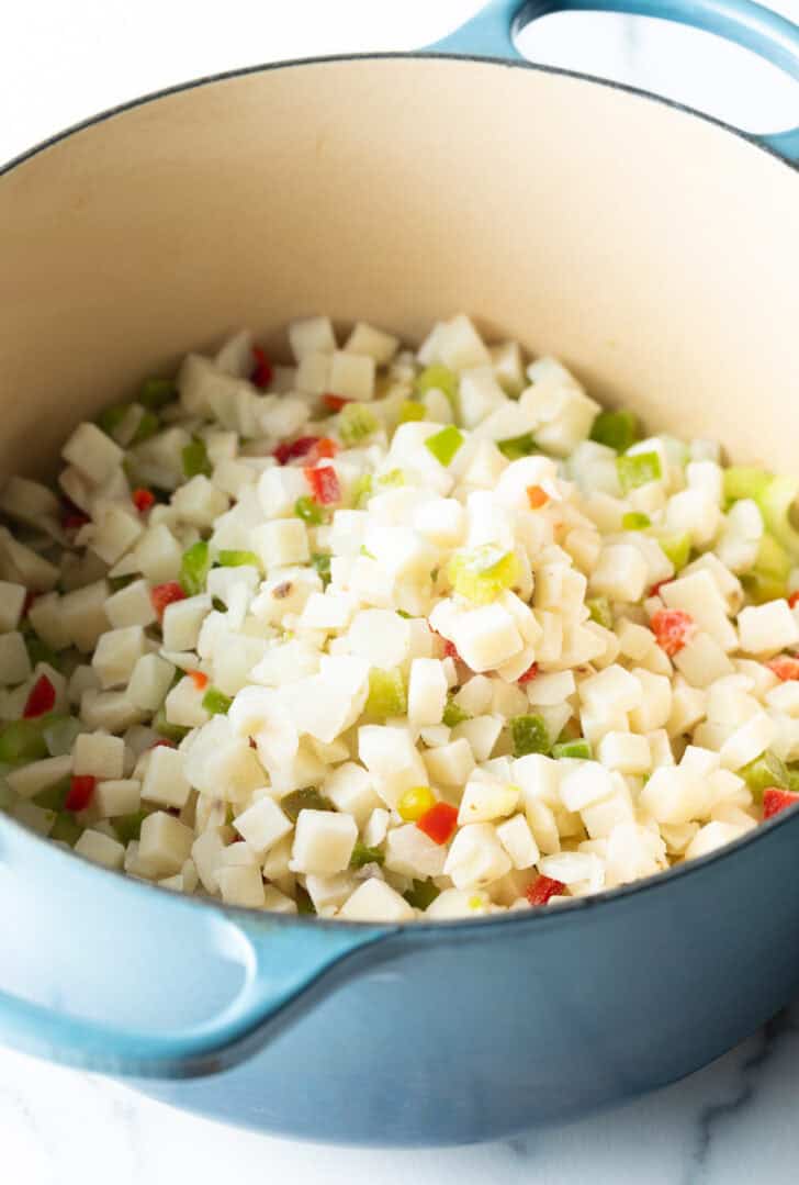 Frozen potatoes o'brien in a large pot.