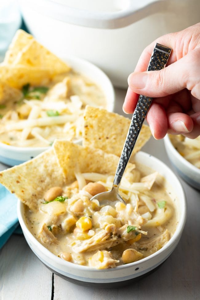 best creamy white chicken chili - spoonful lifted from bowl