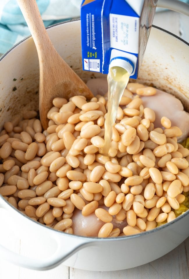 white beans and broth added to chili pot