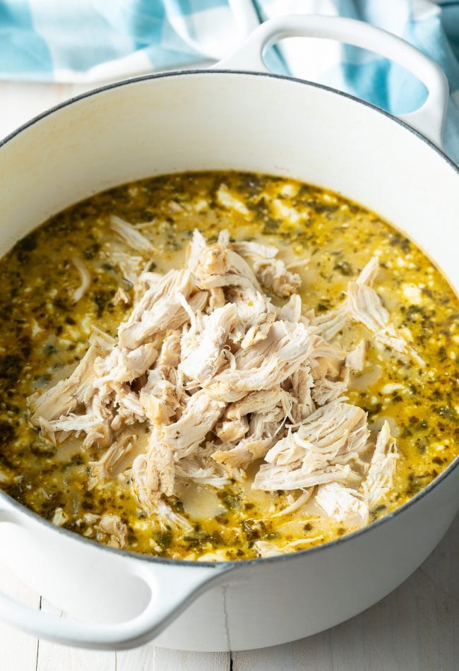 creamy easy white chicken chili with shredded chicken and herbs