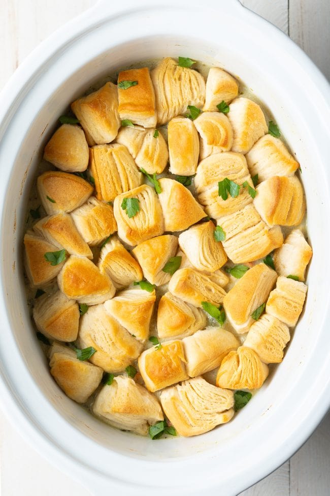 Overhead shot of crockpot chicken pot pie with biscuits on top. 