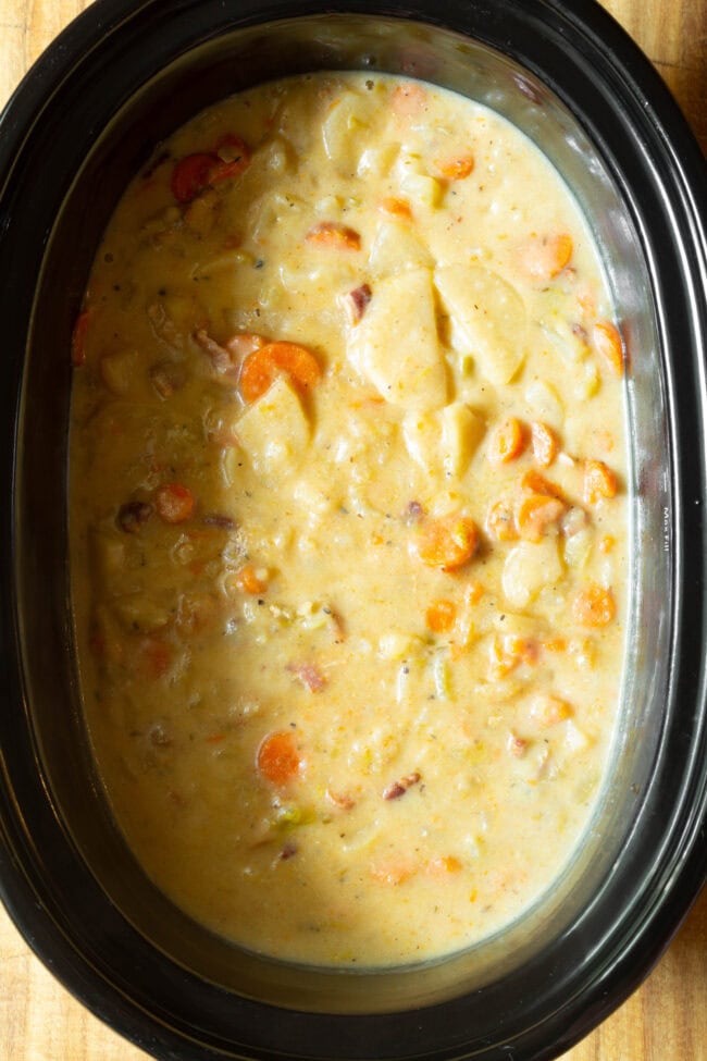 Overhead view of finished potato soup in slow cooker. 