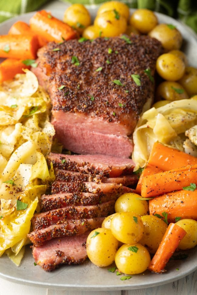 Baked corned beef recipe with cabbage and veggies.