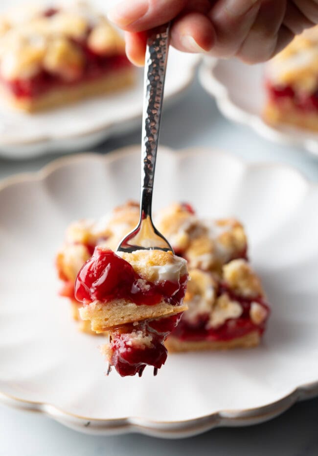 Metal fork with bite of pie.