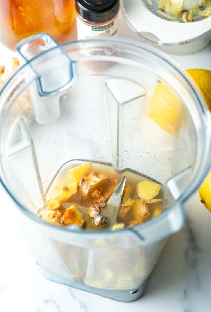 Garlic, lemon, turmeric, in a food processor.