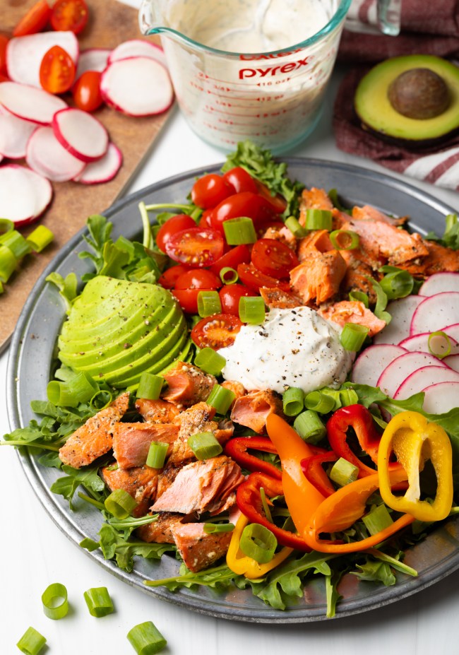 Grilled Salmon Salad Recipe - This healthy and hearty dinner salad is brimming with salmon, avocado, veggies, and a creamy dill dressing. It's a vibrant dish perfect for summer! | A Spicy Perspective