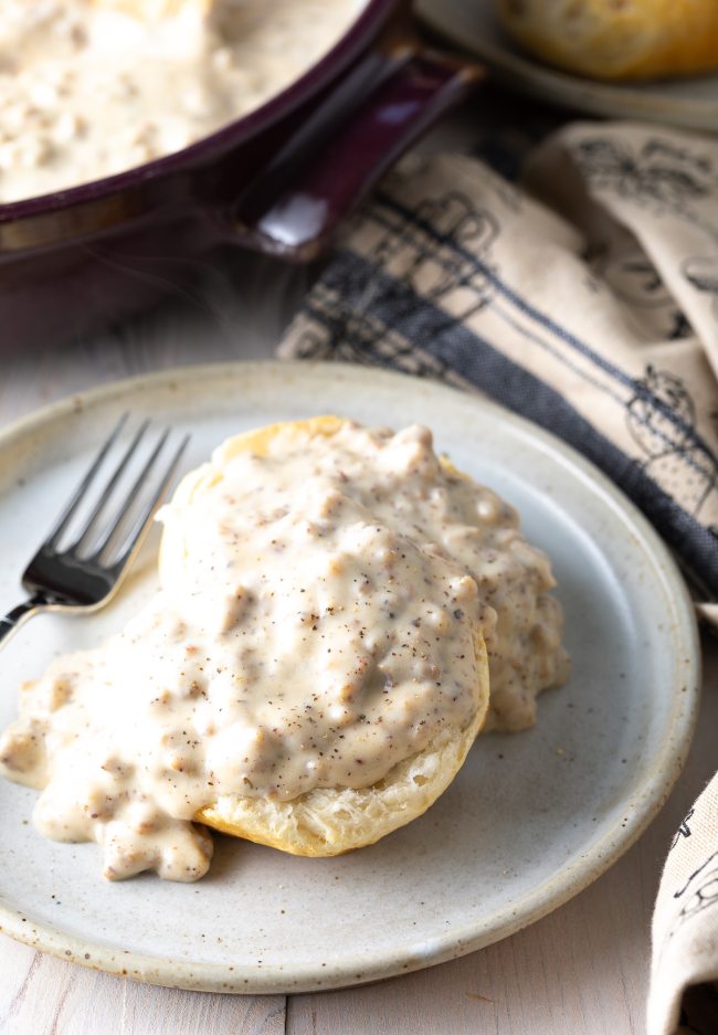 fluffy cathead biscuits covered in white gravy