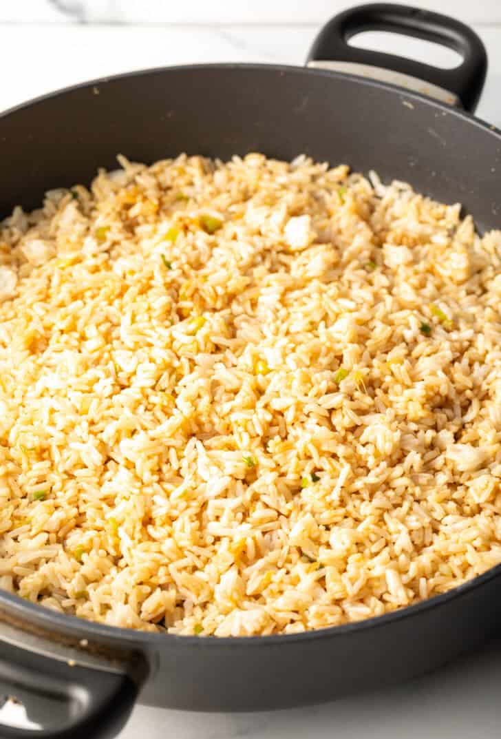 Golden fried rice in a deep skillet.