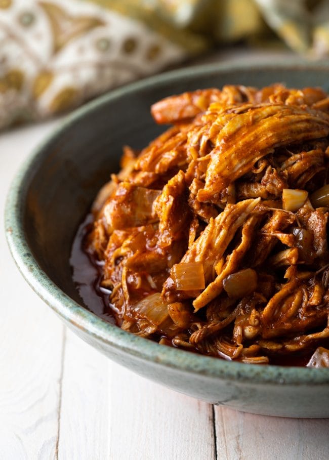 Ethiopian chicken with a dark sauce in a bowl. 