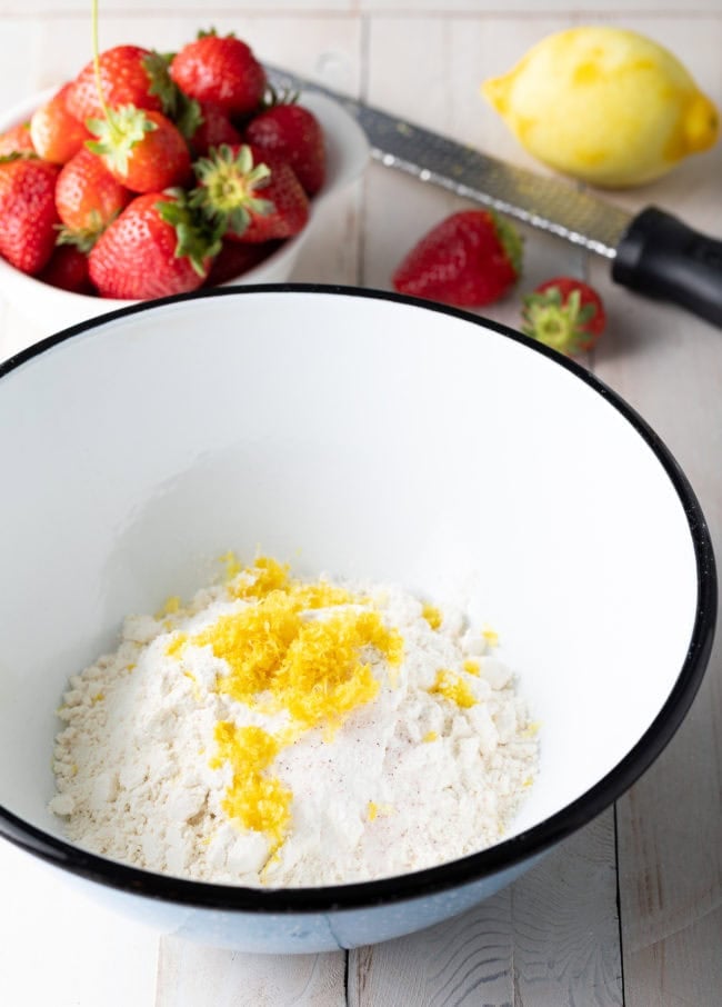 Flour and lemon zest in a mixing bowl. 