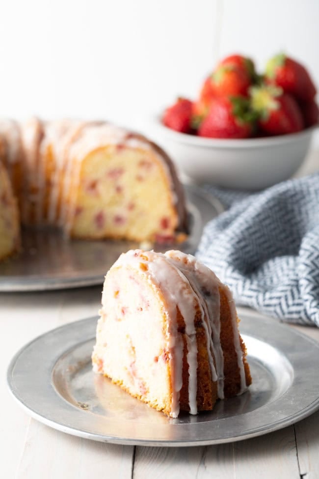 Strawberry Lemon Bundt Cake slice on a plate. 