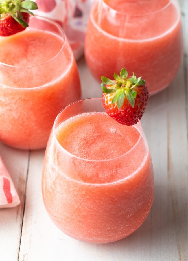 Frosé made with strawberries, vodka, and blush wine - garnished with a strawberry