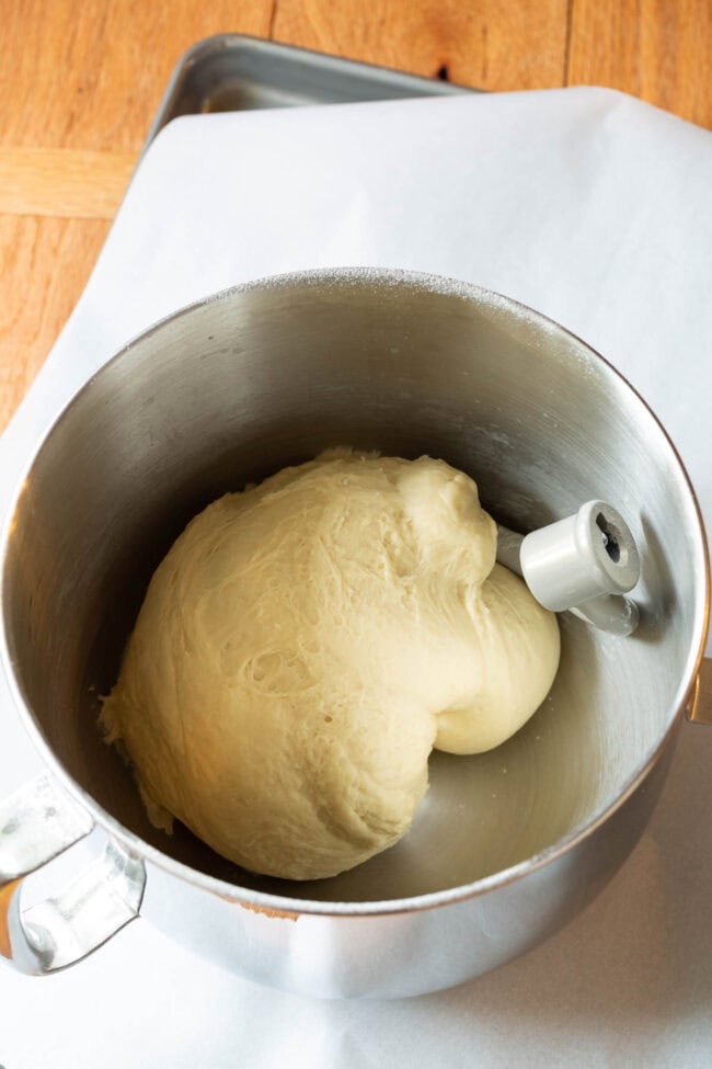 Garlic Knots bread dough in mixing a stand mixer bowl.